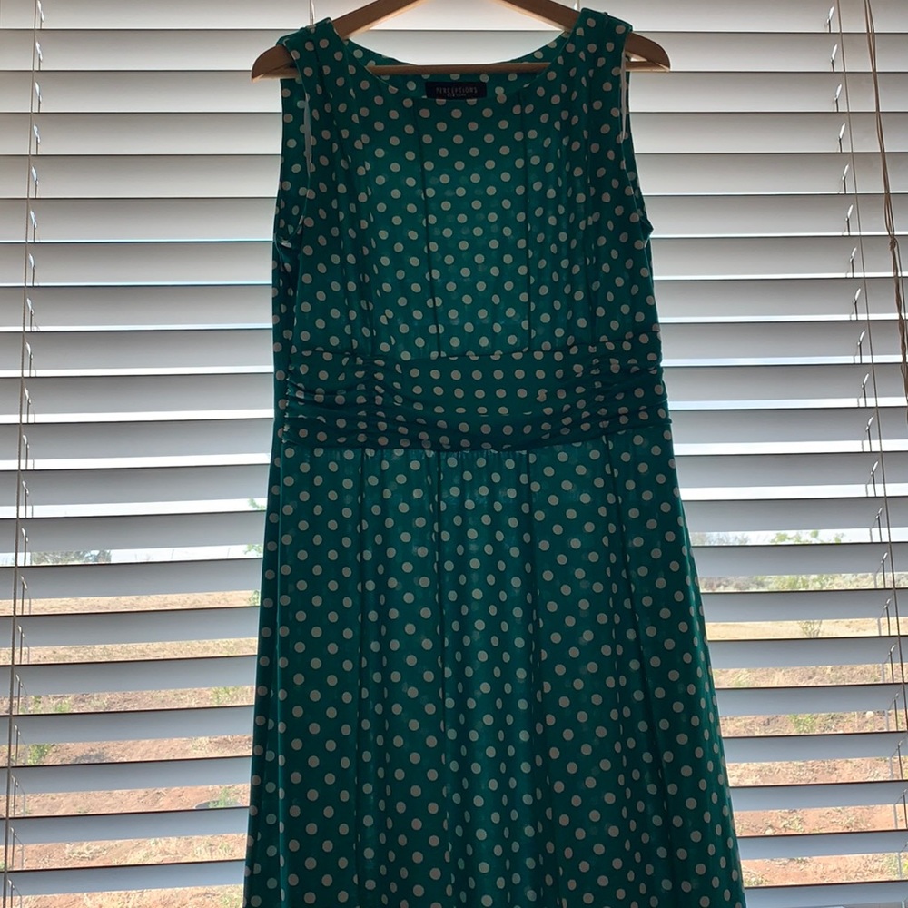 Green with white polka dot, sleeveless dress.